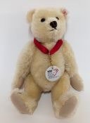 Steiff '100 years bear' with red ribbon and white medal, cream mohair, white ear tag, 671043, LE