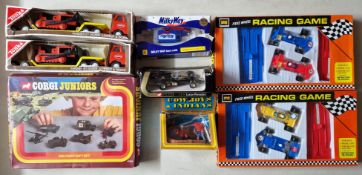Corgi toys, a Corgi Juniors Military Gift Set, together with two Codeg Free Wheel Racing Games,