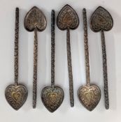 A collection of six ornate white metal heart shaped teaspoons. (6)