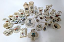 A collection of crested ware, of mainly Devon and Cornwall crests, to include miniature cheese dish,