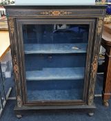 A 19th century ebonised pier cabinet, with elaborate gilt decoration, fitted with two shelves behind
