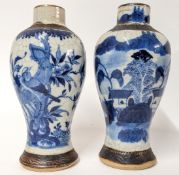 A pair of 19th Century Chinese blue and white vases, with crackle glaze, decorated with floral and