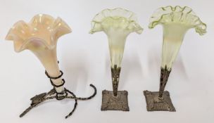 Three Vaseline glass style fluted vases, of trumpet form in metal bases, two a pair of green hue