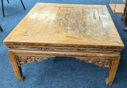 A Chinese carved low table, with intricate carved bracket details to legs and sides, approx 79cm x
