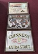 Three decorative painted mirrors, to include 'St Austell Brewery', 'Guinness' and another, framed.