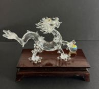 Swarovski Crystal Glass, Dragon with wooden stand, boxed.