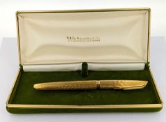 A gilt Waterman fountain pen, cased.