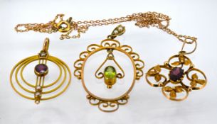 Three Edwardian gem-set pendants, each of varying design including one of circular form set with