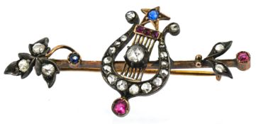 A Victorian diamond, ruby and sapphire lyre brooch, the lyre set with rose-cut diamonds,