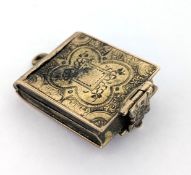 An antique double sided book locket, with bird and foliate carving to the front & floral carving