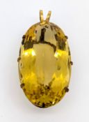 A large citrine pendant, claw set with an oval-cut citrine, measuring approx. 57mm x 34mm x 22mm, '