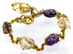 An antique amethyst and pearl bracelet, the curb link bracelet spaced with alternating amethyst