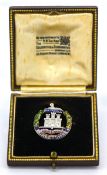 A 9ct gold enamelled Dorset Regiment sweetheart brooch, the design featuring the Gibraltar Castle