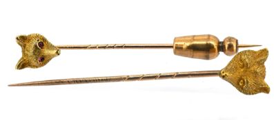 Two antique fox head stick pins, one with red stone cabochon eyes, unmarked, total gross weight 3.
