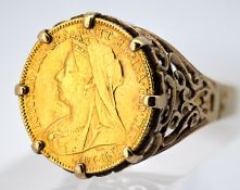 A half sovereign ring, the ornate openwork 9ct gold ring mount set with a Victoria 1896 half