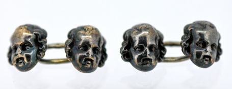 A pair of silver Edwardian cherub cufflink's, indistinct marks, 3.3grams.