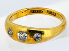 A three stone diamond ring, set with three old-cut diamonds, marked 18ct, size R1/2, 7.0grams.