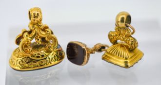 Three various antique fobs, including an ornate 9ct gold fob set to the bottom with bloodstone,