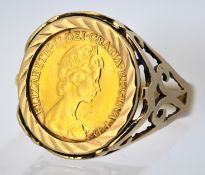 A half sovereign ring, the ornate openwork 9ct gold ring mount set with an Elizabeth II 1982 half