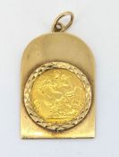 A half sovereign pendant, a George V 1914 half sovereign in an arched rectangular shaped pendant