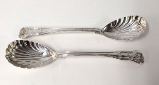 A pair of silver William IV shell-shaped spoons, hallmarked London 1837