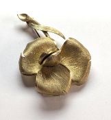 A rose brooch with a secret hidden watch under hinge leaf, '17 Jewels Incabloc' text on face of