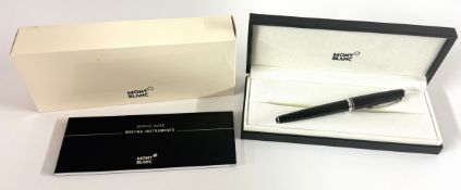 Montblanc, a black resin rollerball pen, with service guide book and box.