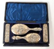 A silver vanity brush set with silver handheld mirror, maker Henry Mathews, hallmarked Birmingham