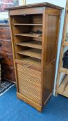 An early 20th century oak tambour front filing cabinet, height approx. 125cm.
