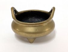 A 19th/20th century bronze Chinese censer, with an apocryphal QING mark, height 8cm.