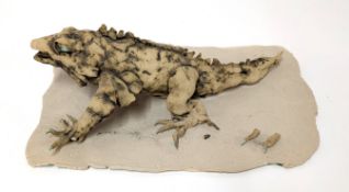 Stephen Thompson (b.1955), original lizard sculpture on clay base, length 31cm