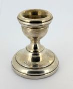 A silver candlestick holder with felt base, hallmarked Birmingham 1972, height approx. 6cm.