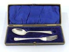 A cased silver spoon and fork, hallmarked Sheffield 1900/1898, weight approx. 1.5oz.