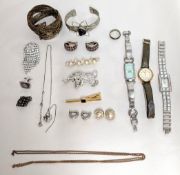 A silver cuff bangle set with a black stone, clip on earrings, brooch, watches etc.