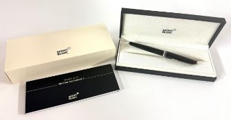 Montblanc, a black resin rollerball pen, with service guide book and box
