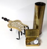 A trivet, accompanied with a Christmas 1914 Mary tin with military brooches and pocket watch inside