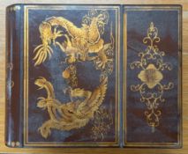 A Chinese dressing table box designed as two books with mirror and drawer, width approx. 26cm.