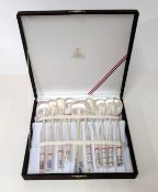 A cased set of Chinese silver chopsticks and spoons, stamped '99%' and 'PISA'