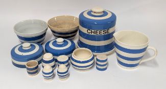 A collection of blue and white unmarked ceramics, including an assortment of bowls, lids, salt