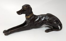 A bronze art deco-style dog sculpture, length approx. 44cm.
