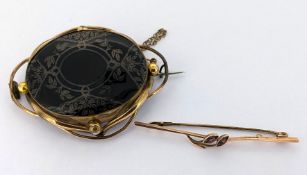 Two antique brooches, including a Victorian gilt mourning brooch, length approx. 5.3cm