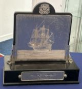 An ebonised and silver presentation dressing table mirror, set in silver with Plymouth Coat of Arms