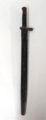 A military bayonet with scabbard.