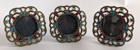 Three small circular Butler & Wilson photo frames, height approx. 9cm. (3).
