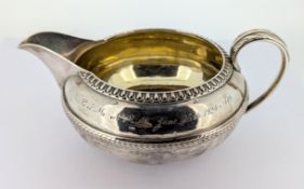A George III silver milk jug, hallmarked London 1813, total weight approx. 6.78oz.