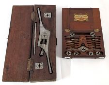 A tap and die set in wooden boxes, largest box width 38cm.