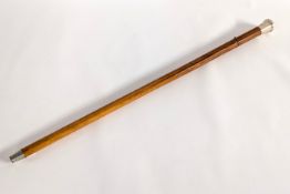 A wooden sword cane with silver hilt, hallmarked Birmingham 1957.