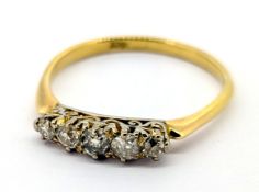 A five stone diamond ring, claw set with five graduated old-cut diamonds, marked 18ct, size U