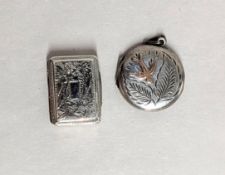 A silver snuff box decorated with flowers (hallmark indistinct) together with a silver locket