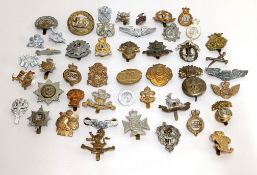 An assortment of 47 military badges, mainly army.